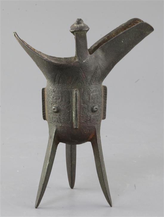 A Chinese archaic bronze wine vessel, Jue, Shang dynasty or later, 19cm high